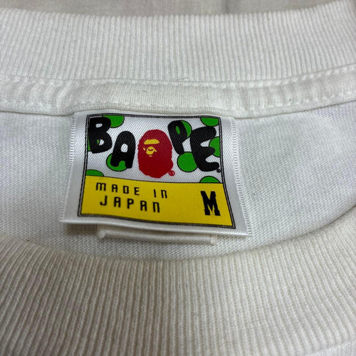 Een badende aap T-shirts symbool T M