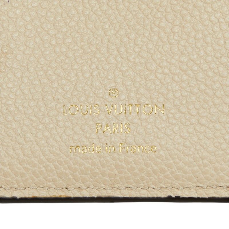 louis vuitton m81071 cream wallet condition details