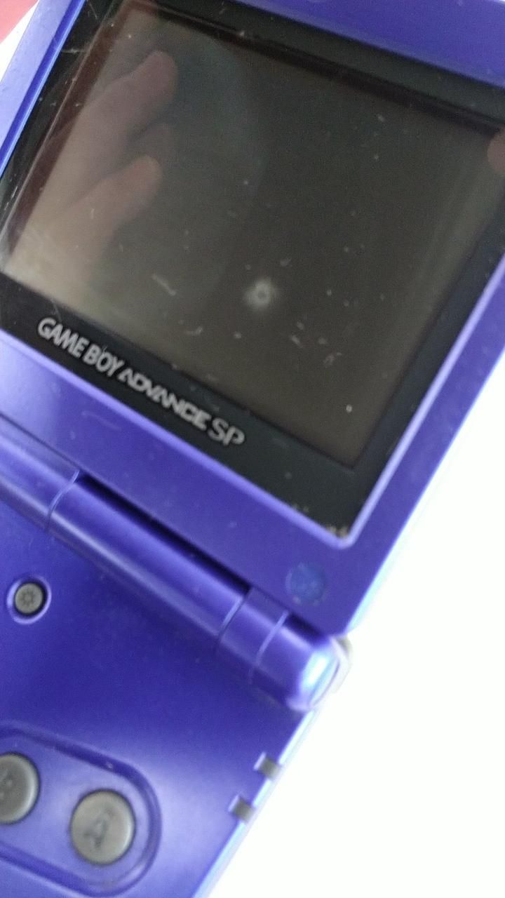 nintendo ags-001 handheld console side view