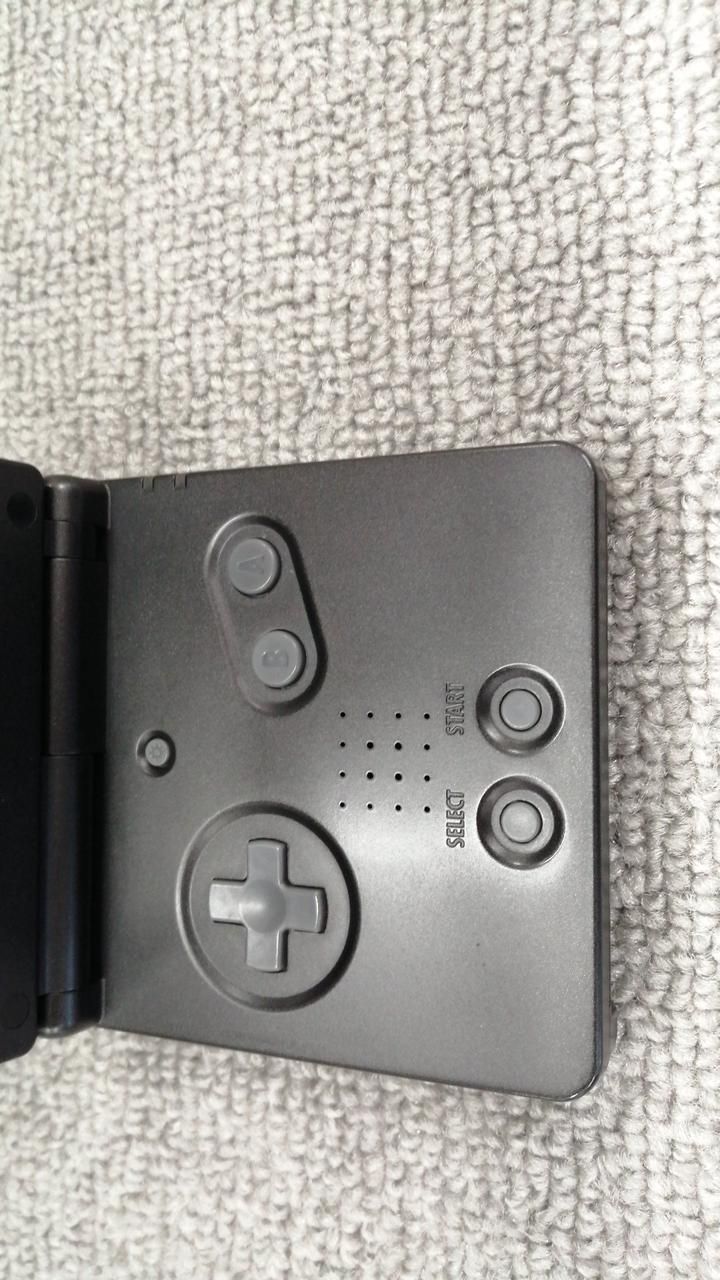 nintendo ags-001 handheld console front view