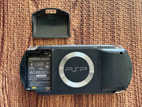 sony psp-1000 handheld console side view