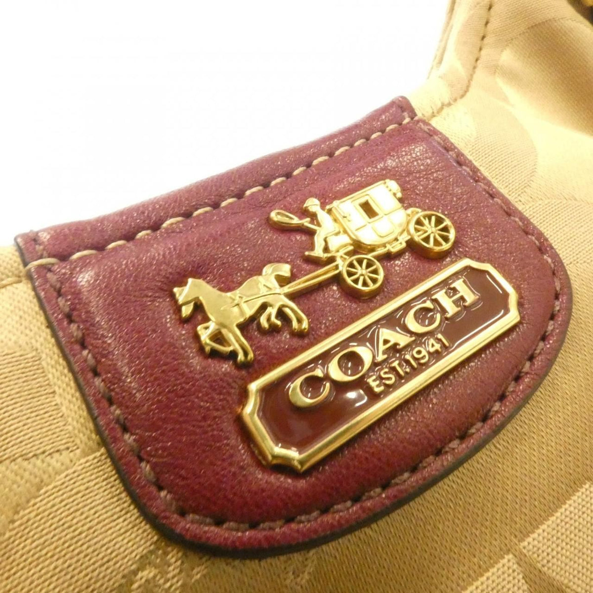 coach beige tote bag side view