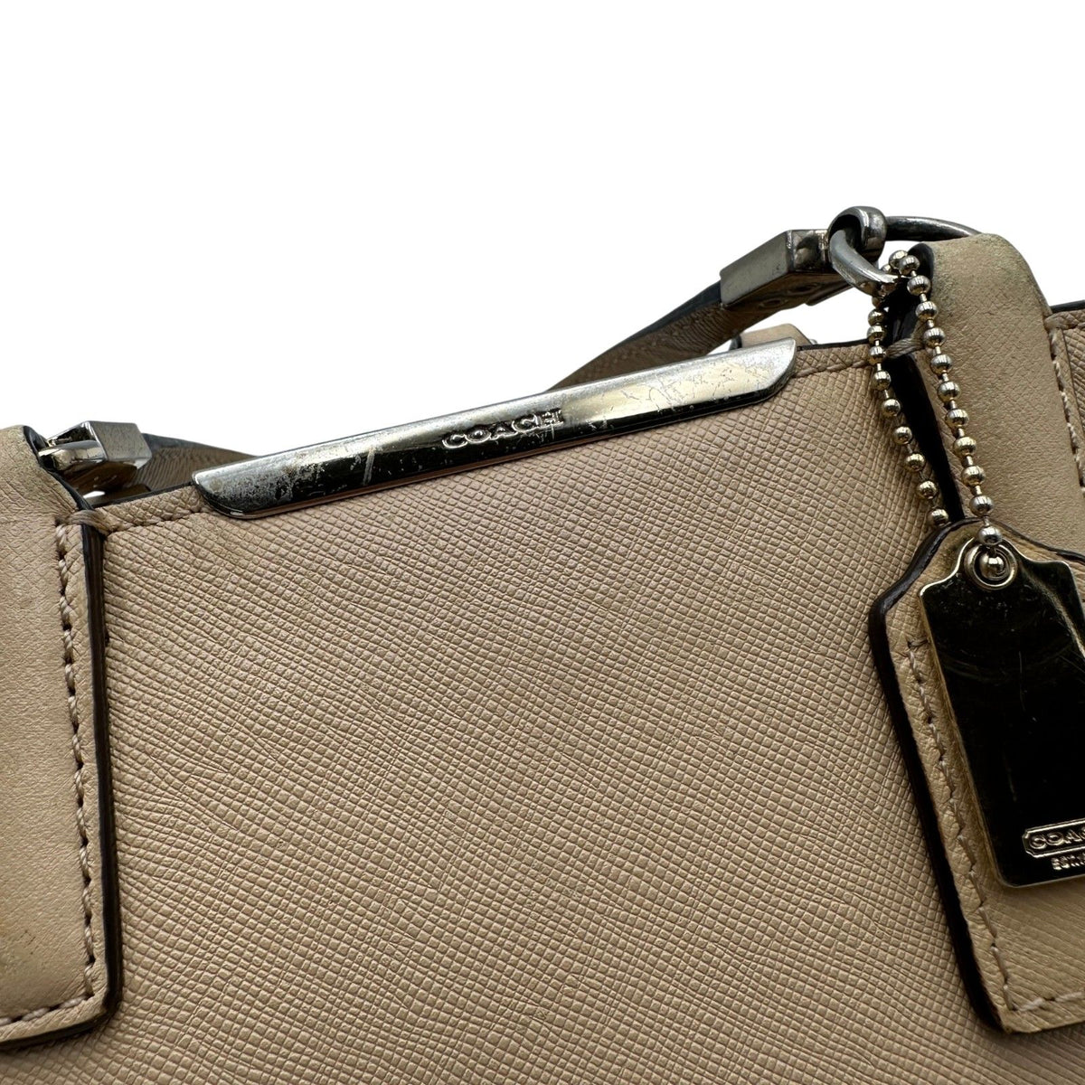 coach beige handbag side view