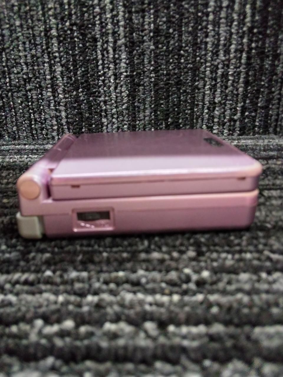 nintendo ags-001 handheld console side view