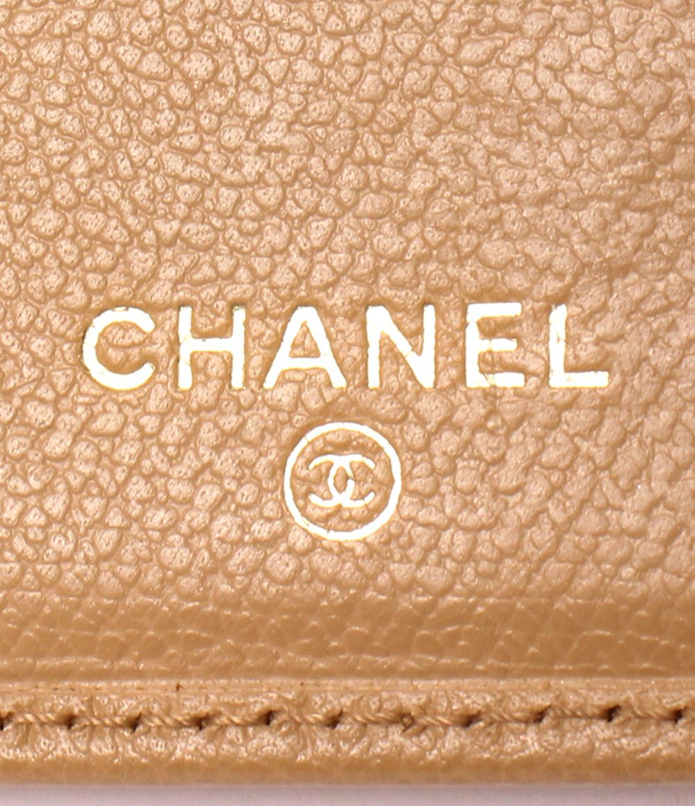 chanel beige wallet side view