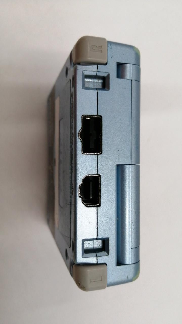 nintendo ags-001 handheld console rear view