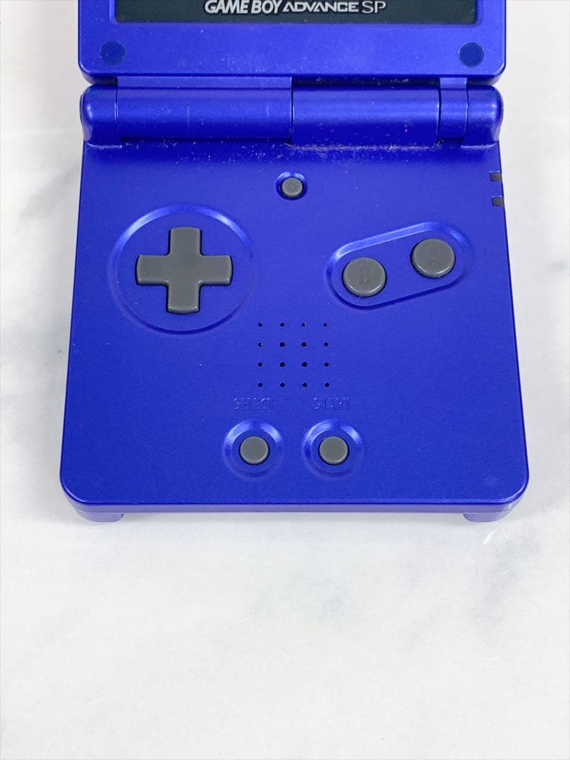nintendo ags-001 handheld console side view