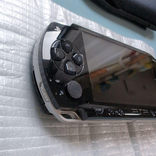sony psp-1000 handheld console side view
