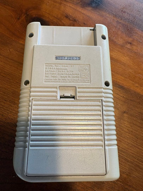 nintendo dmg-01 handheld console front view