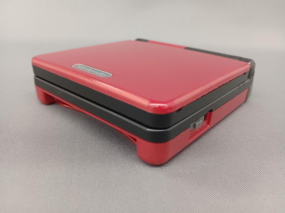 nintendo ags-001 handheld console side view