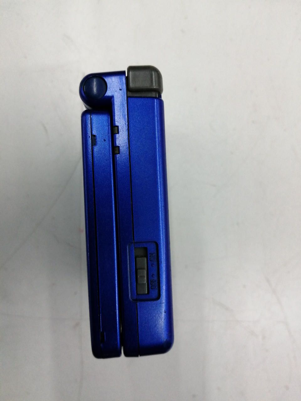 nintendo ags-001 handheld console side view