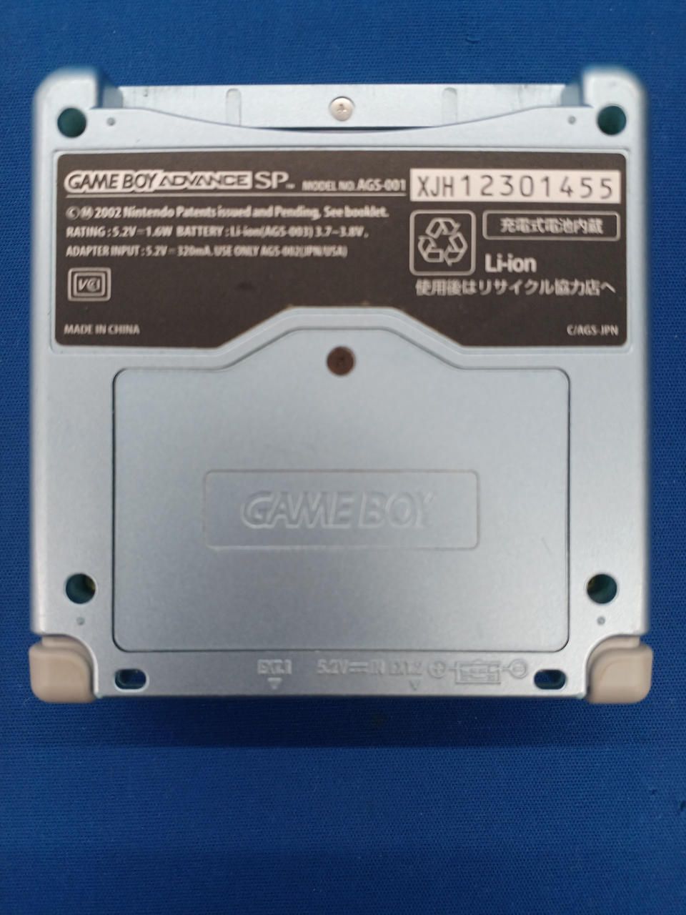 nintendo ags-001 handheld console side view