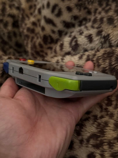 nintendo agb-001 handheld console side view