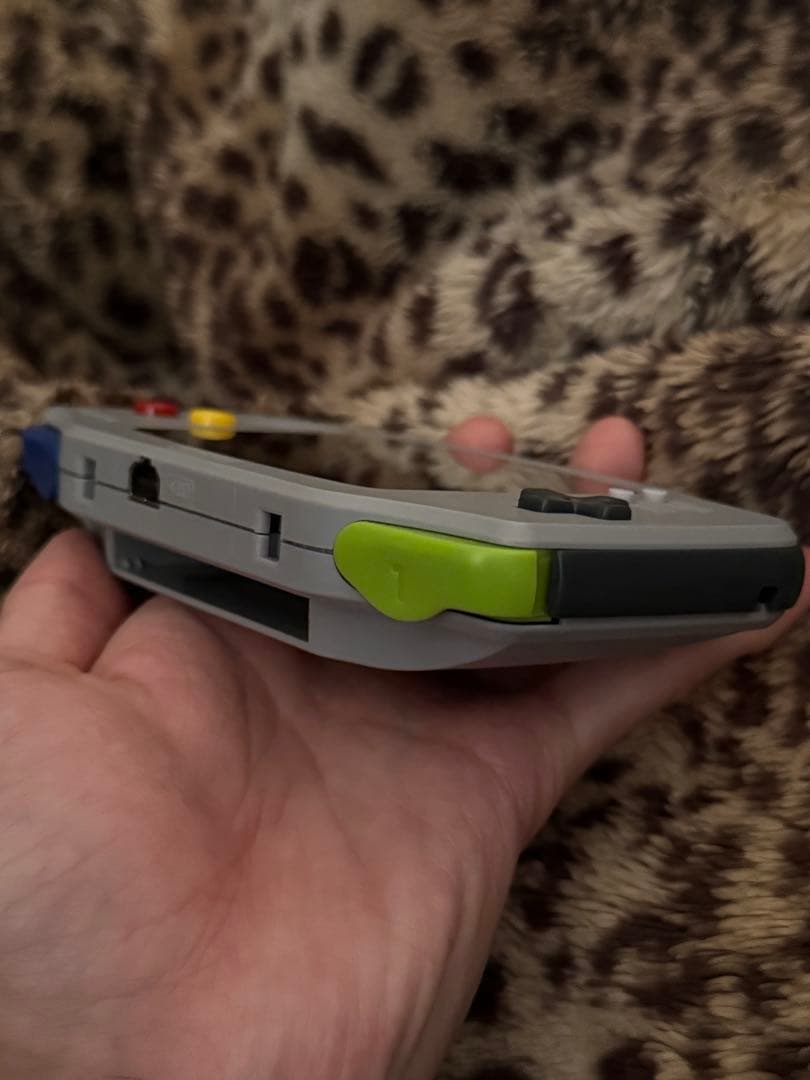 nintendo agb-001 handheld console side view