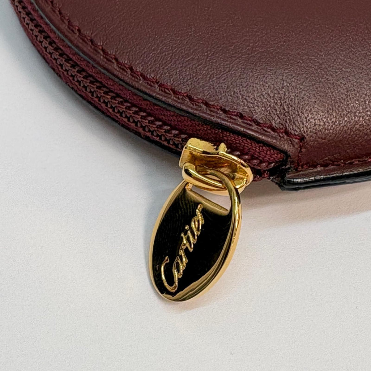 cartier coin purse side view