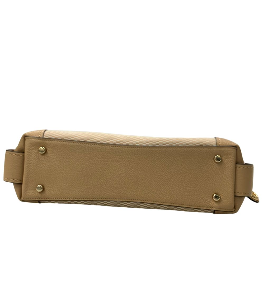 coach beige tote bag side view