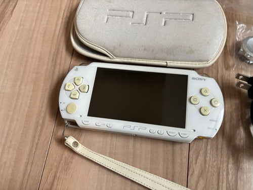 sony psp-1000 handheld console front view