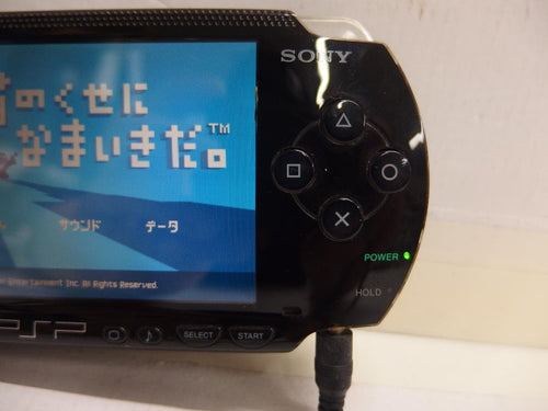 sony psp-1000 handheld console side view