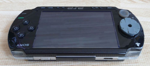 sony psp-1000 handheld console front view