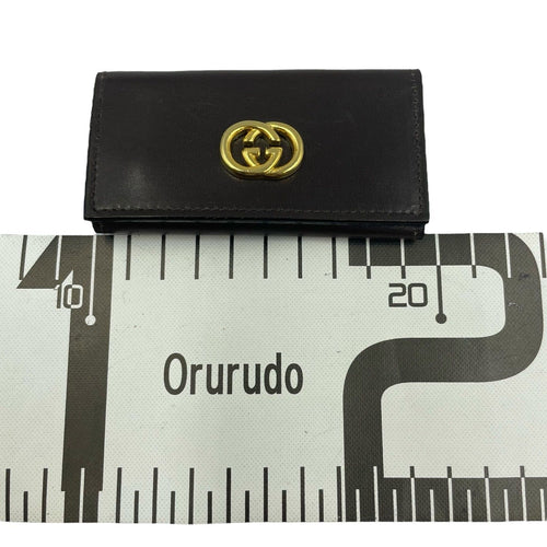 gucci key case markings and labels
