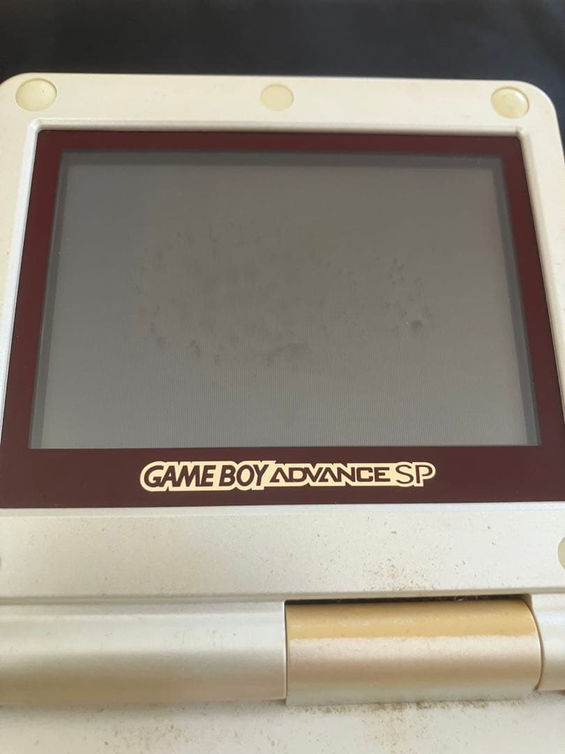 nintendo ags-001 handheld console side view