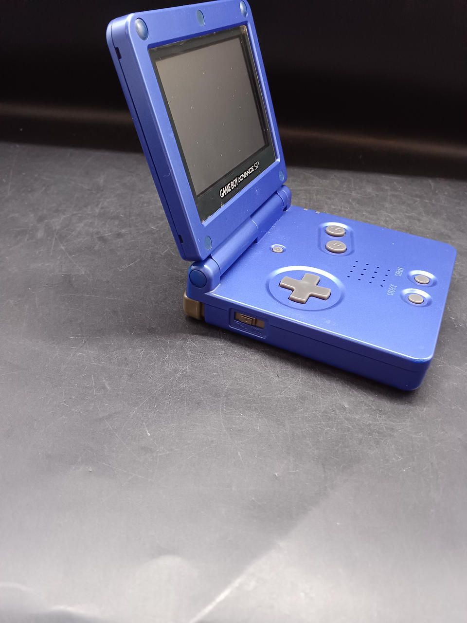 nintendo ags-001 handheld console rear view