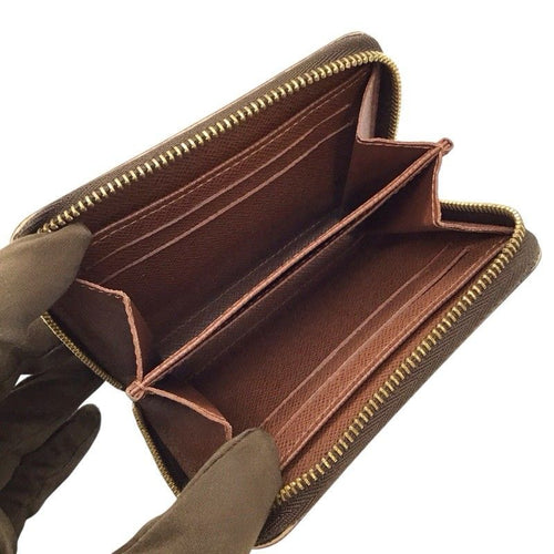 louis vuitton m60067 coin purse condition details