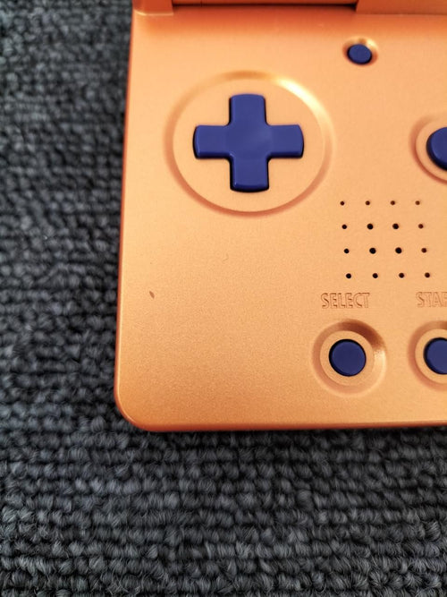 nintendo ags-001 orange handheld console rear view
