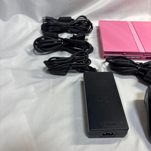 sony scph-77000 pink video game console side view