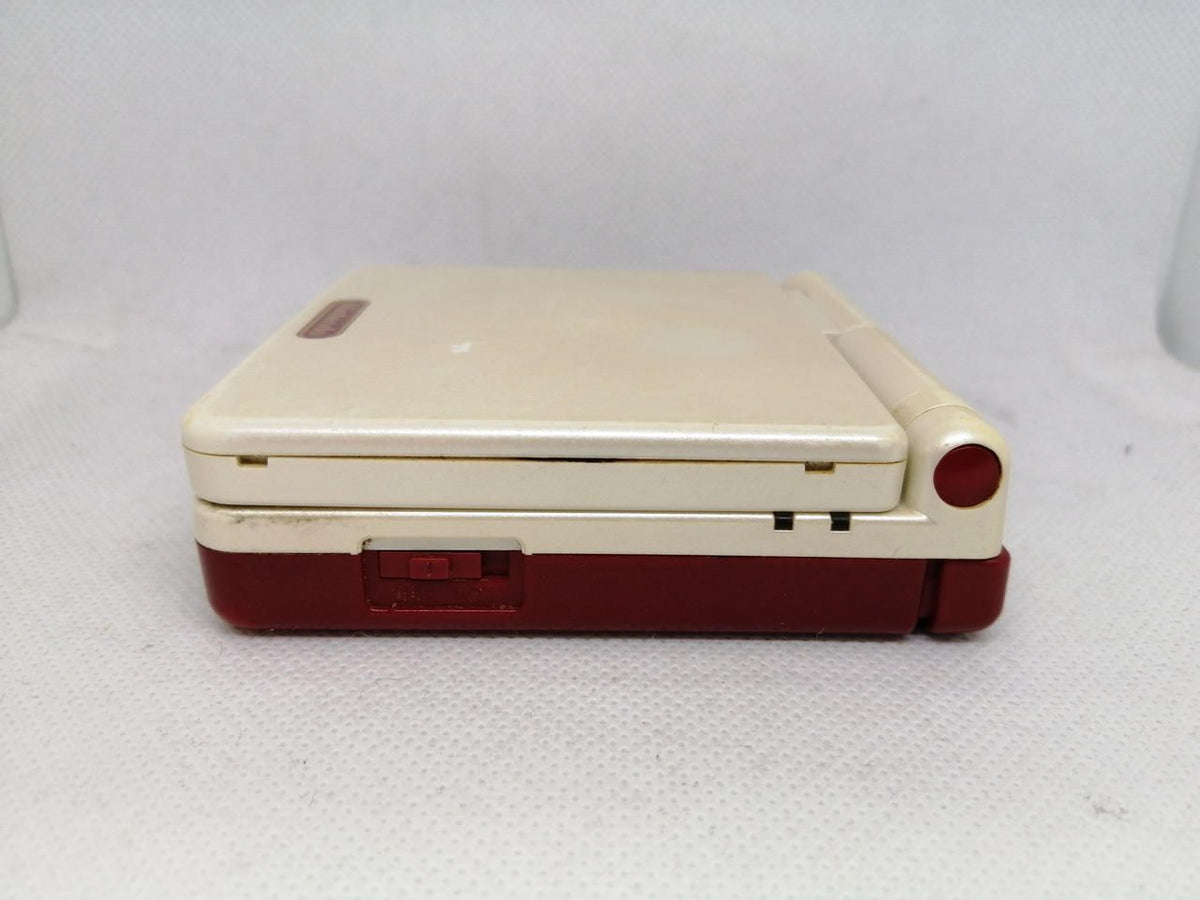 nintendo ags-001 handheld console side view